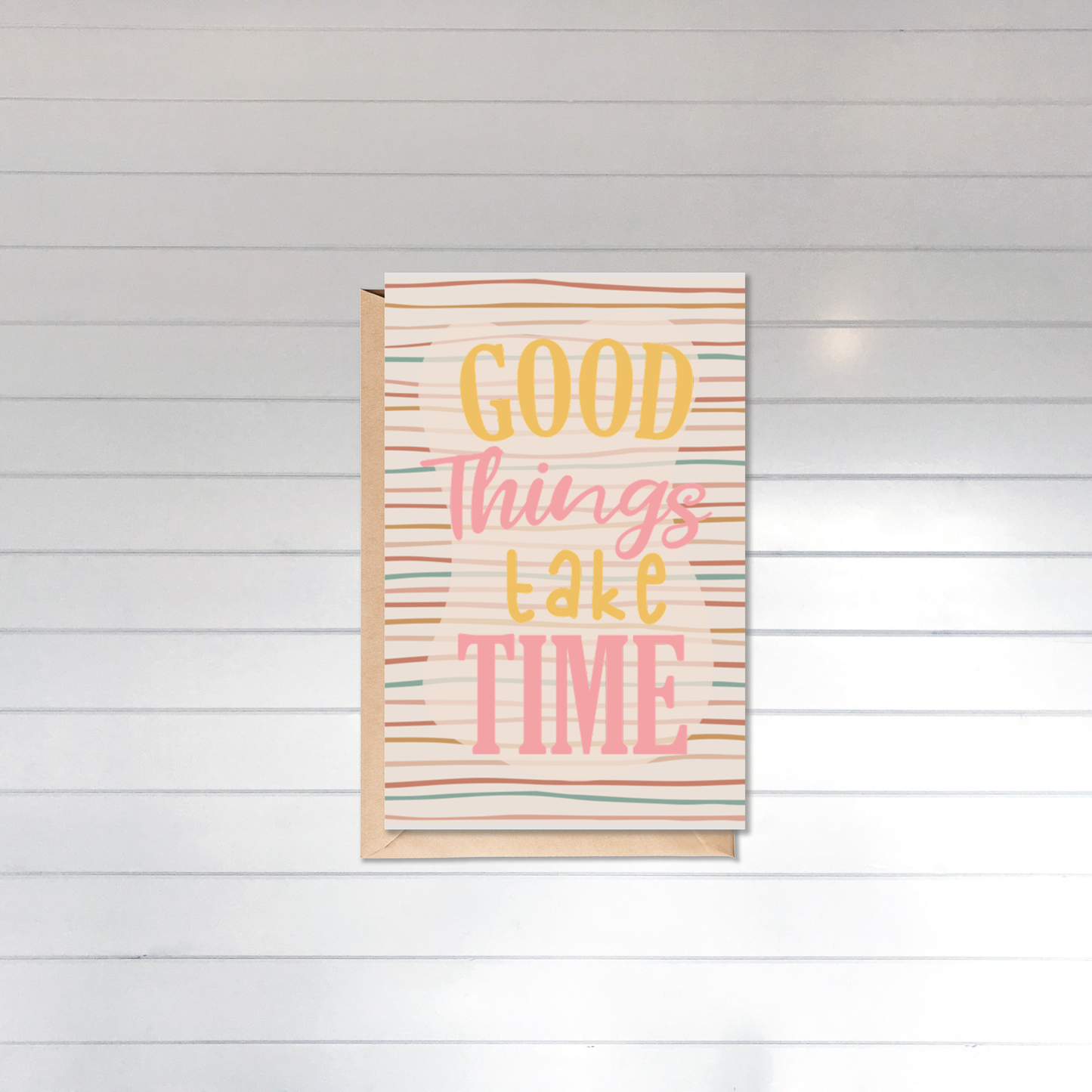 Decorative box with 'Good Things Take Time' text on a white wooden background
