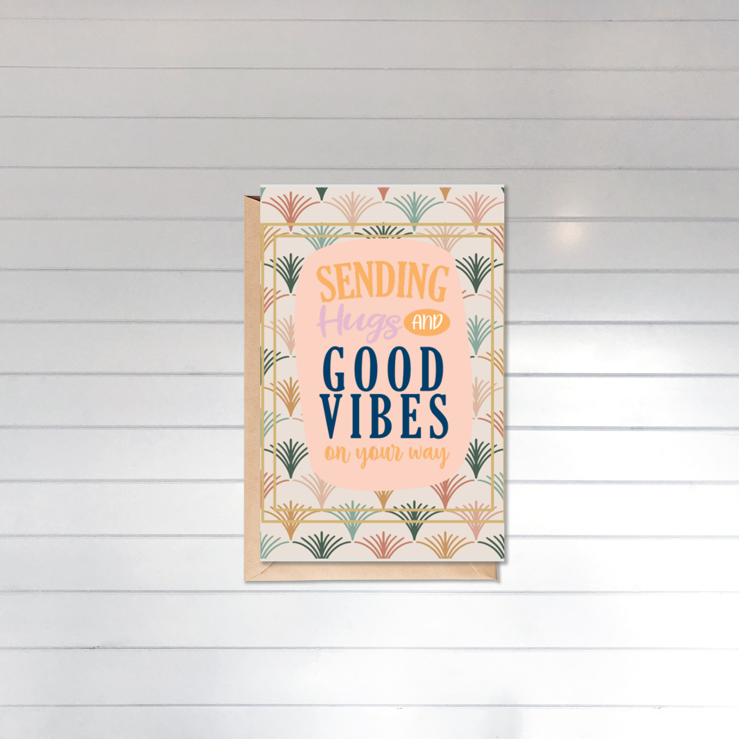 Framed artwork with 'Sending hugs and good vibes' text on a wooden panel background
