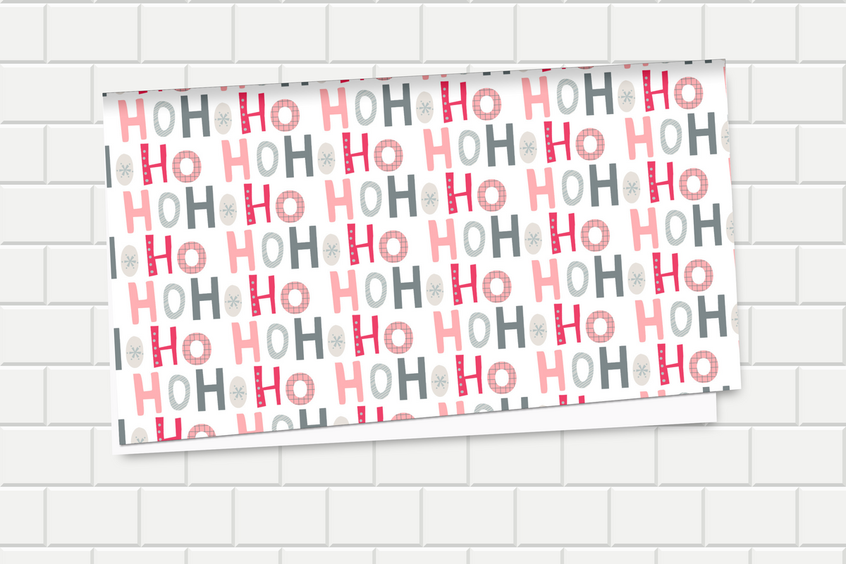 Wrapping paper with 'HO HO HO' pattern on a tiled wall background