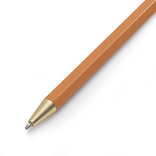 Brown pen with gold cap on a white background