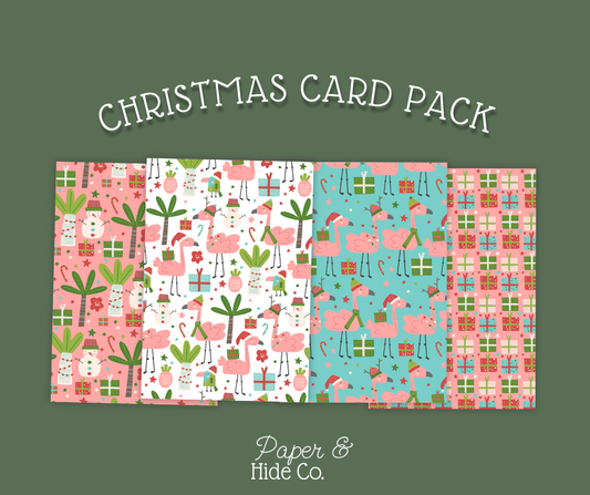Christmas card pack with flamingo and gift pattern on a green background, featuring the brand 'Paper & Hide Co.'