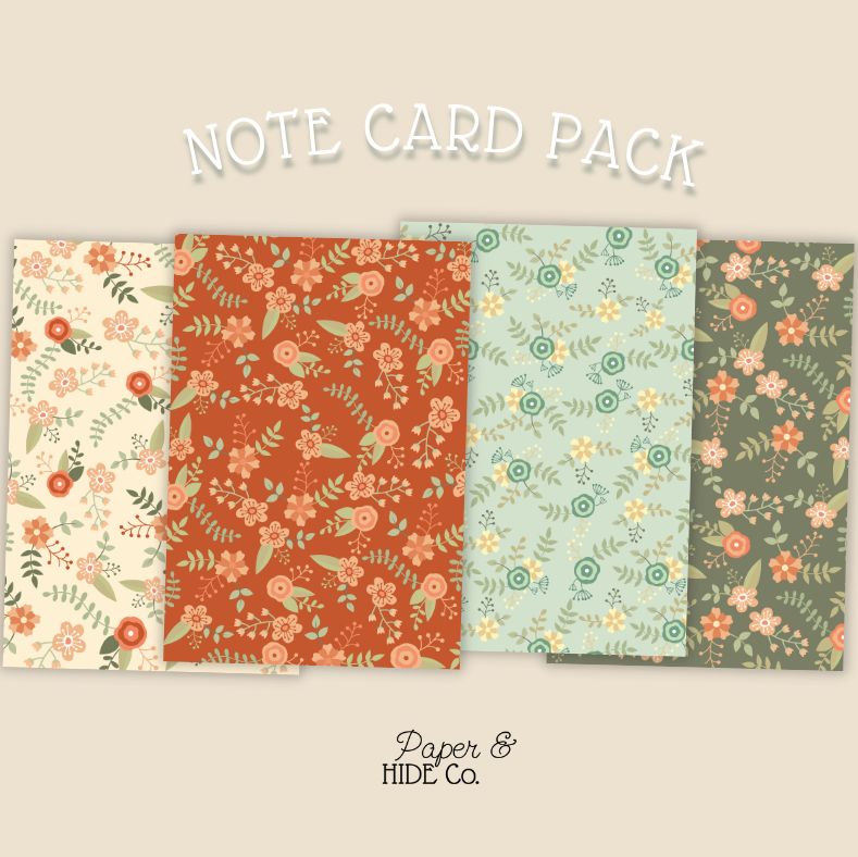 Note card pack with floral designs on a beige background, featuring the brand 'Paper & Hide Co'.