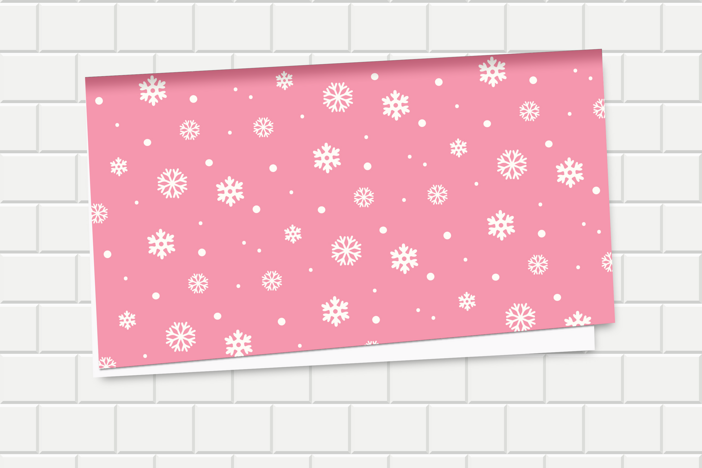 Pink paper with white snowflake pattern on a tiled background