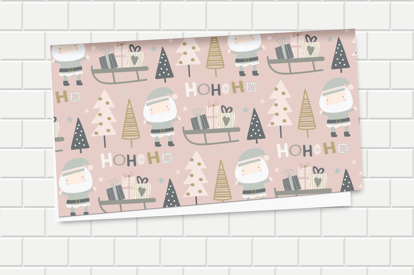 Christmas-themed wrapping paper with Santa Claus, trees, and presents on a pink background.