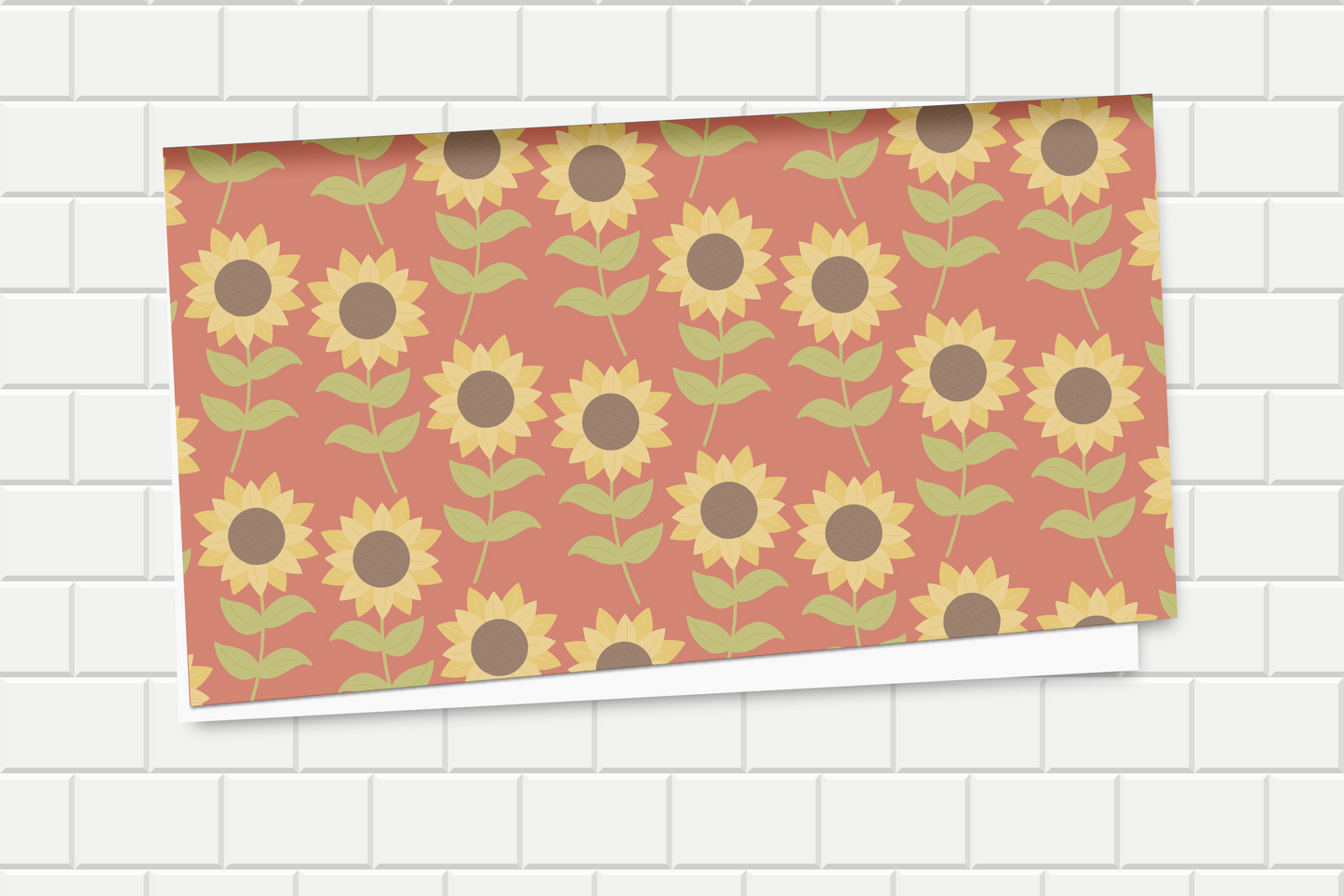 Wrapping paper with sunflower pattern on a white tiled background