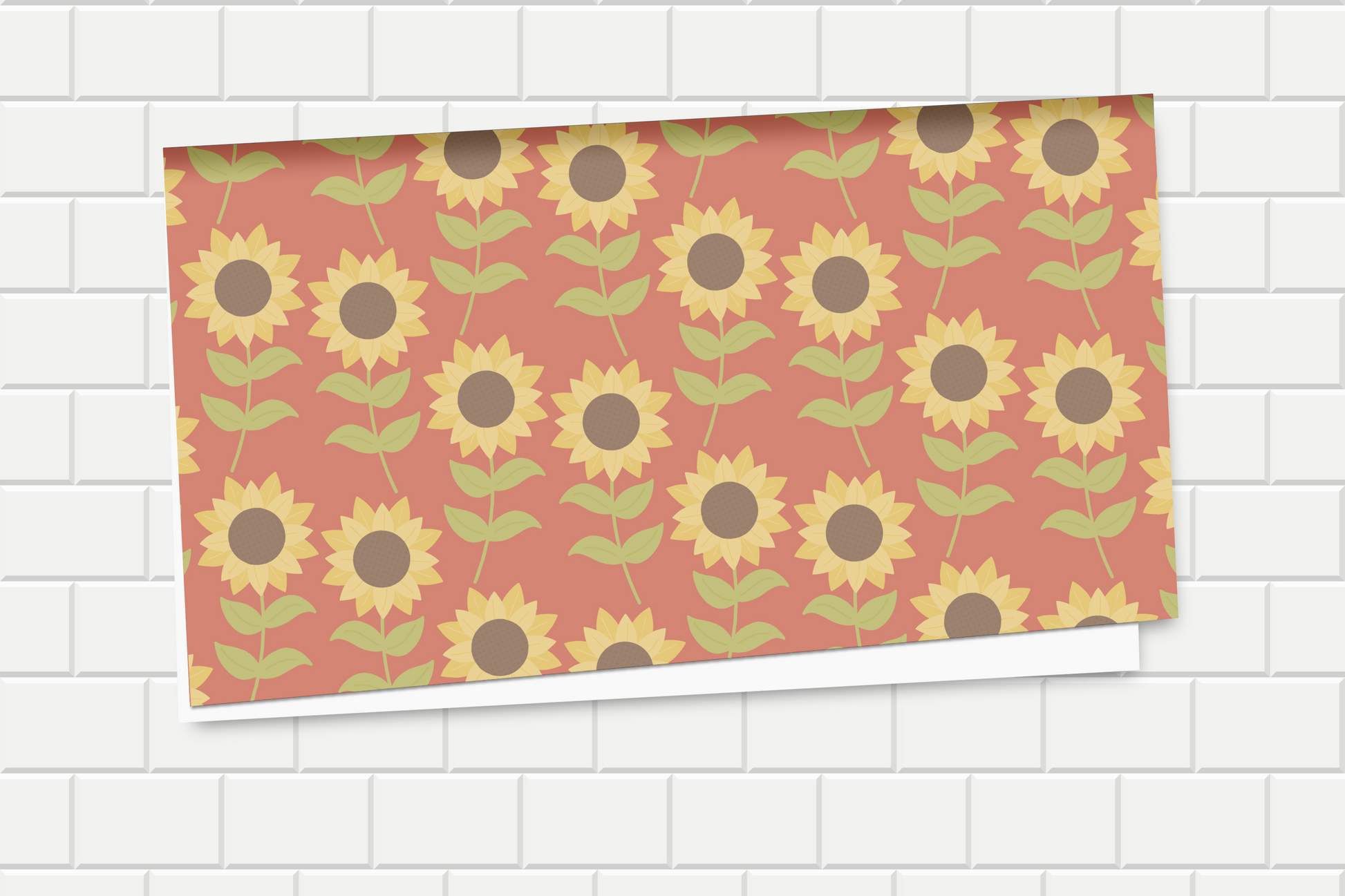 Wrapping paper with sunflower pattern on a white tiled background