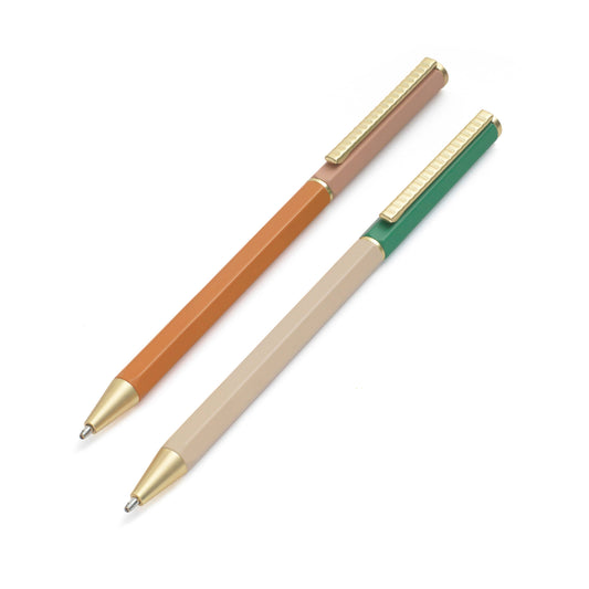 Three pens with different colored bodies and gold accents on a white background